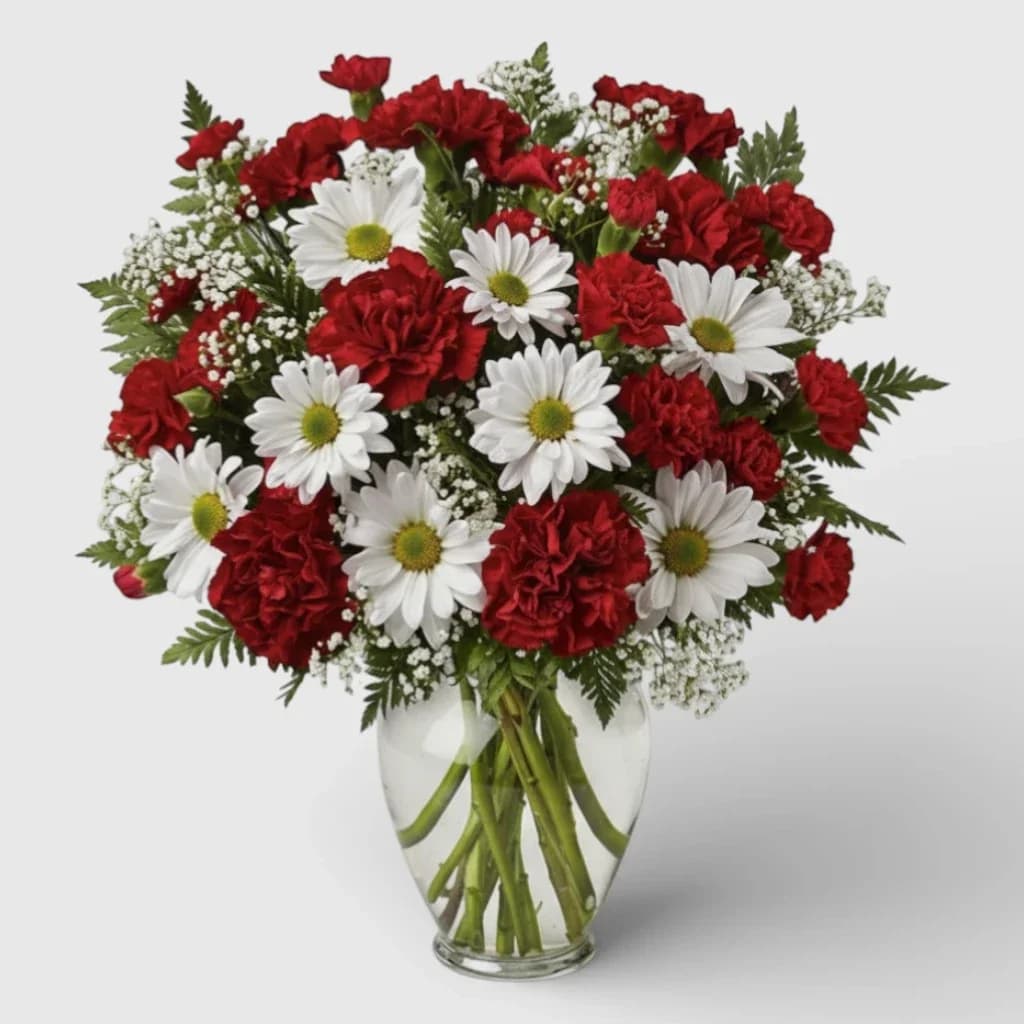 Un bouquet d'œillets rouges et de chrysanthèmes blancs