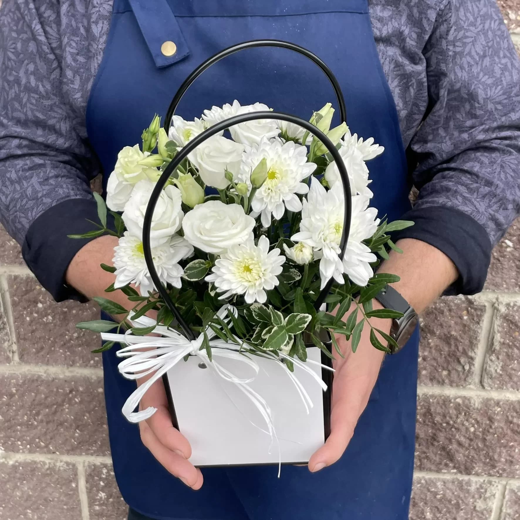 Les fleurs dans le sac à main